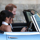 Prince Harry, Duke of Sussex, and his new bride, the Duchess of Sussex, leave Windsor Castle after their wedding to attend an evening reception at Frogmore House, hosted by the Prince of Wales, on May 19, 2018, in Windsor, England.